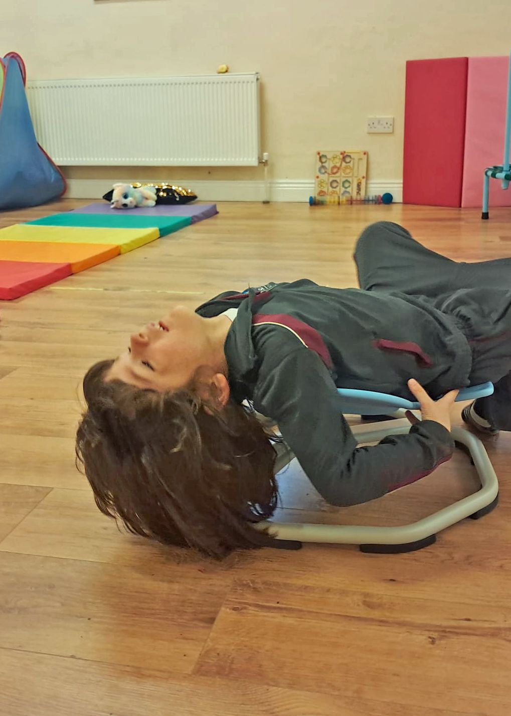 boy in white crew neck t-shirt sitting on bed